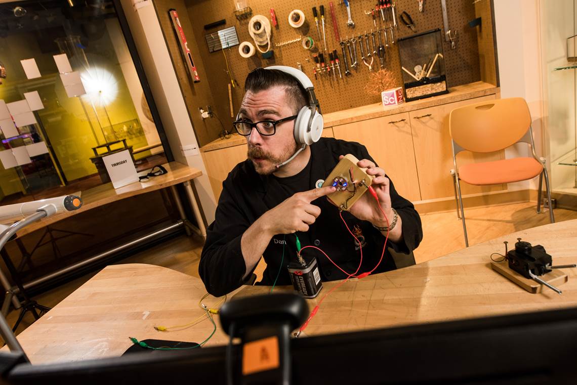 Man testing an experiment in a workshop