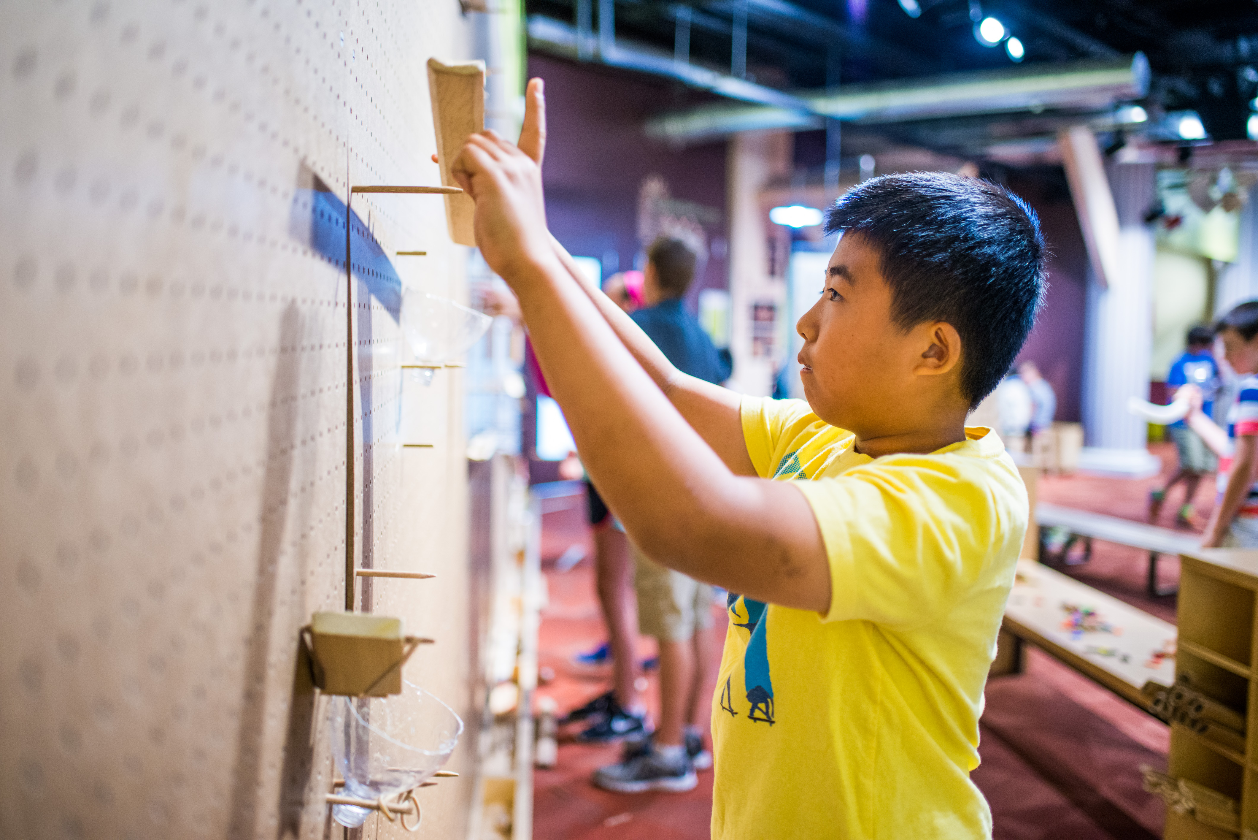 child using the marble run exhibit