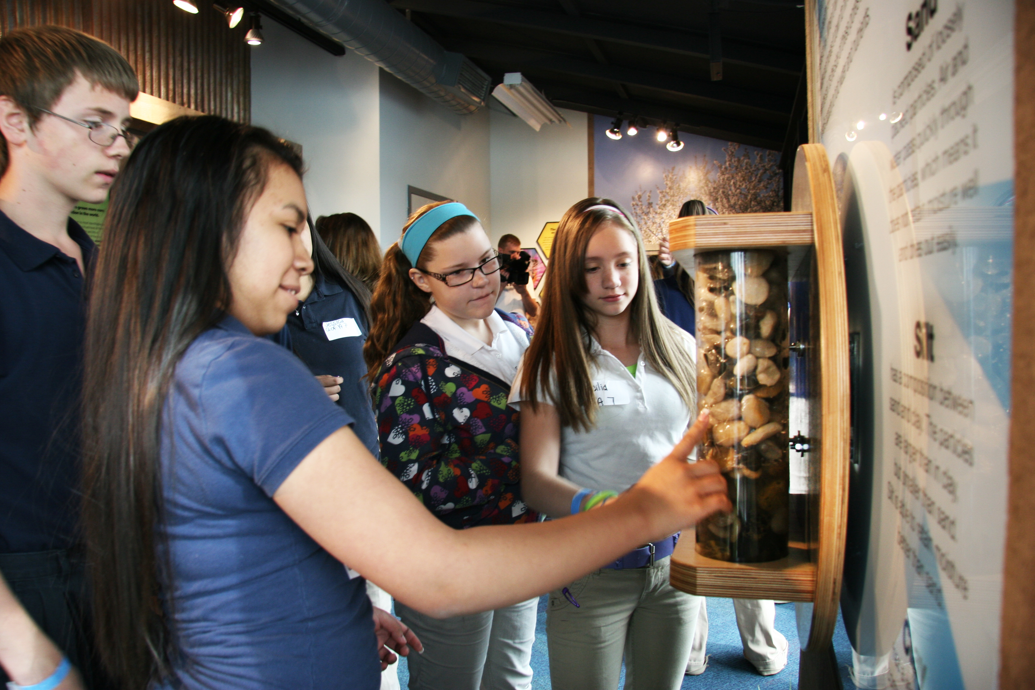Students interacting with exhibit
